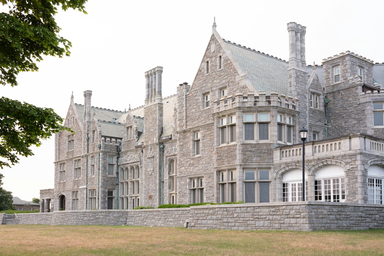 a large stone building with a clock on the front of it